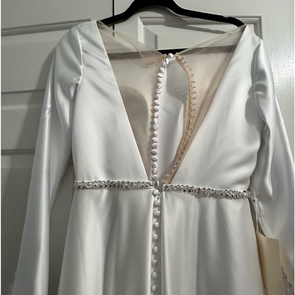 Wedding dress with tags. Rhinestone embellished at waist,real button closure. - Picture 4 of 7